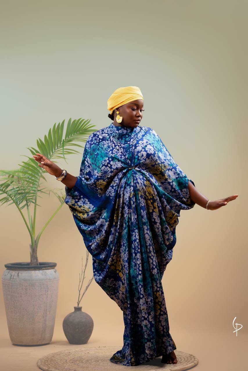 Same outfit styled for evening: blazer removed, camisole with layered delicate necklaces, trousers with strappy heels